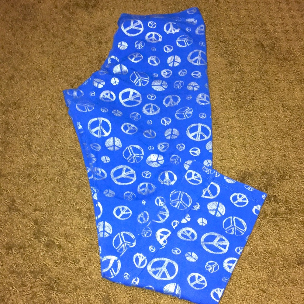 Peace signs leggings size 14 Girls blue pants EUC